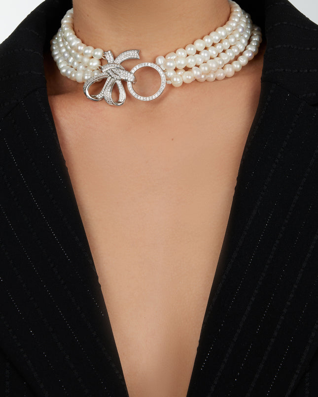 Pearl necklace with bow rhinestone clasp.
